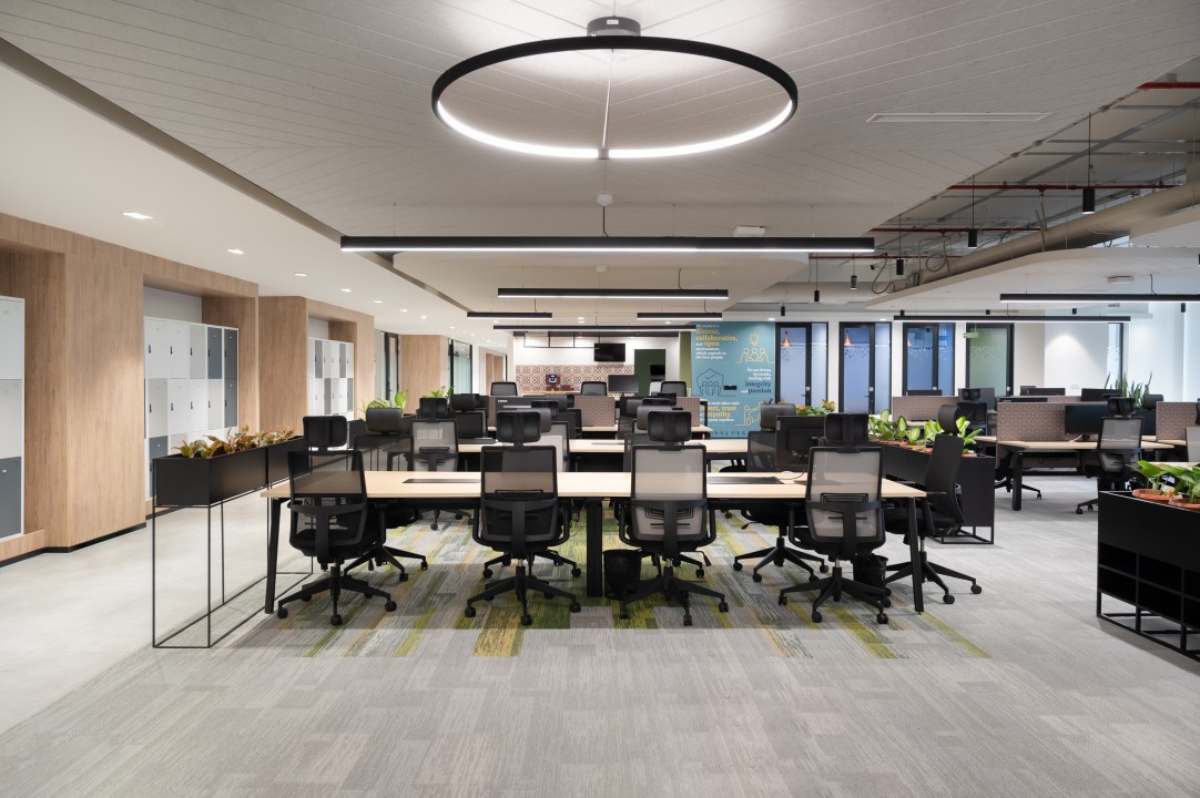 Modern office space with natural lighting and collaborative areas